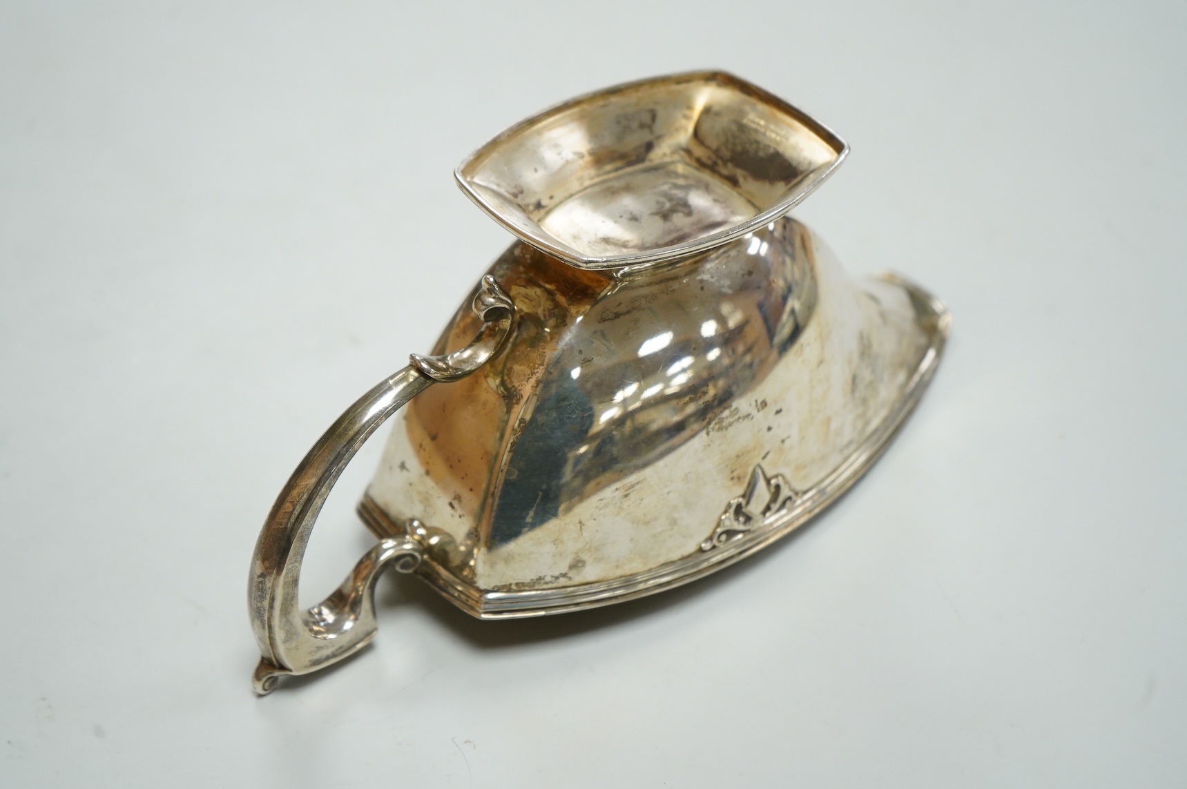 A George VI silver sauceboat by Mappin & Webb, Sheffield, 1938, with engraved initial, length 20cm, 6.9oz.
